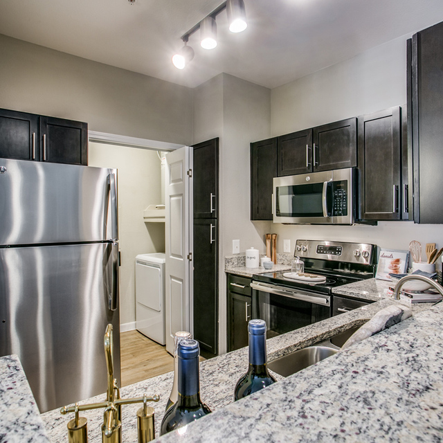 Essex House - Kitchen with Stainless Steel Appliances and Granite Countertops