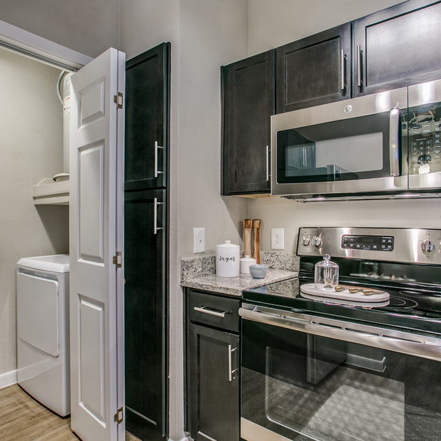 Essex House - Kitchen with Stainless Steel Appliances and Granite Countertops